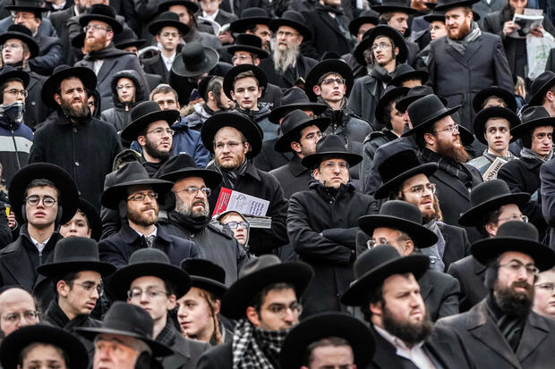 Orthodox Jews take part in the 13th Siyum HaShas, a celebration marking the completion of the Daf Yomi, a seven-and-a-half-year cycle of studying texts from the Talmud, the canon of Jewish religious law, at MetLife Stadium in East Rutherford, New Jersey,  