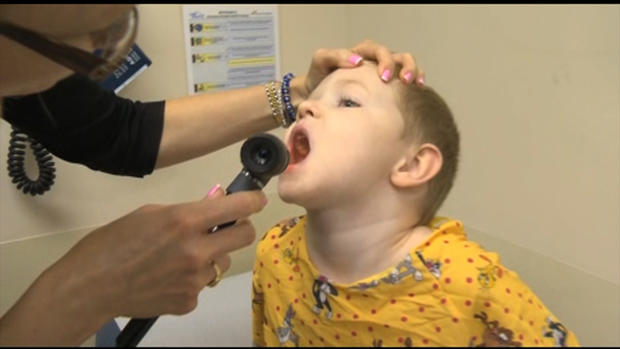 Child Is Examined For The Flu 