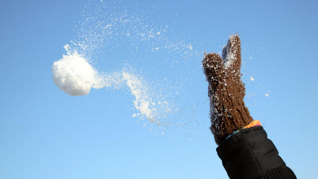 Snowball in childs hands 