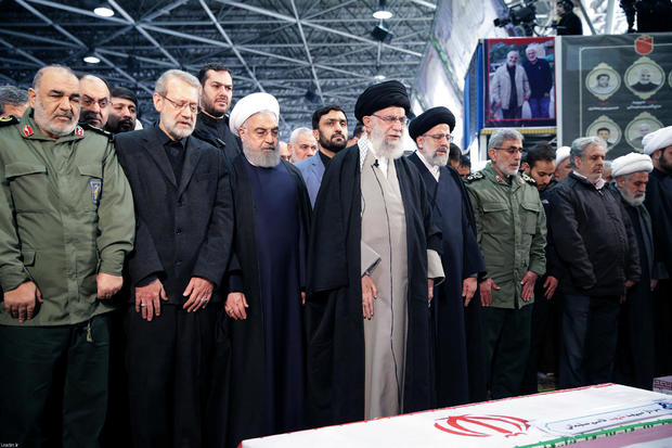 Iran's Supreme Leader Khamenei and President Rouhani pray near the coffin of Iranian Major-General Qassem Soleimani in Tehran 