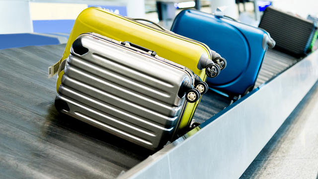Suitcases on conveyor belt in the airport 