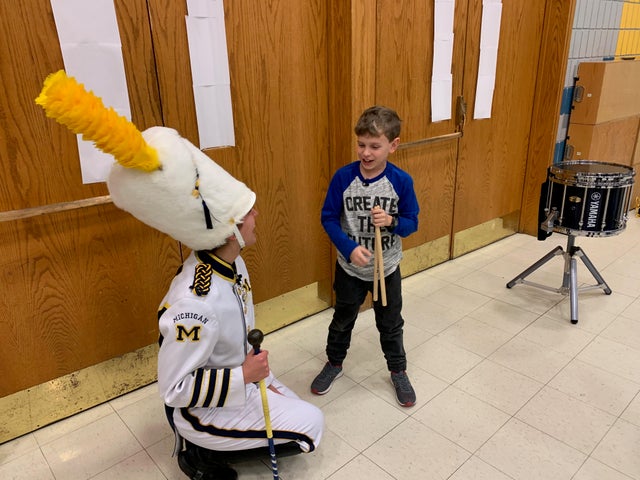 The Michigan Marching Band finds a future recruit in a 9-year-old 