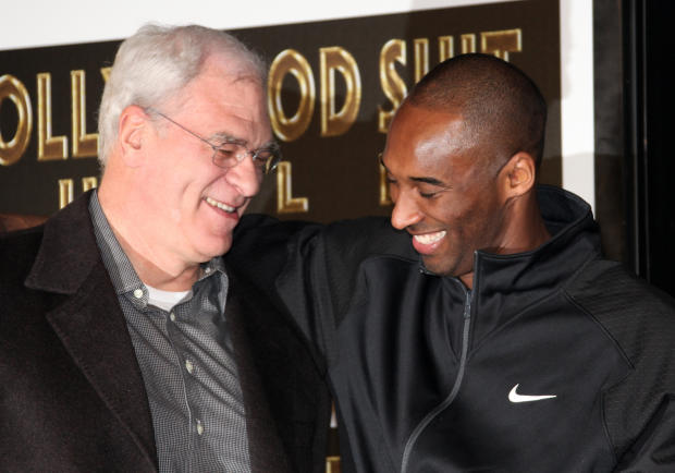 Los Angeles Lakers head coach Phil Jackson and Kobe Bryant attend Bryant's hand and footprint ceremony at Grauman's Chinese Theater on February 19, 2011, in Hollywood, California. 