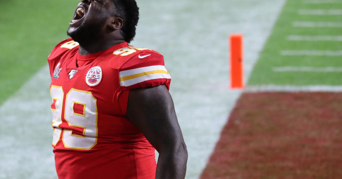 Kansas City Chiefs' Demone Harris (52) plays with the confetti, at