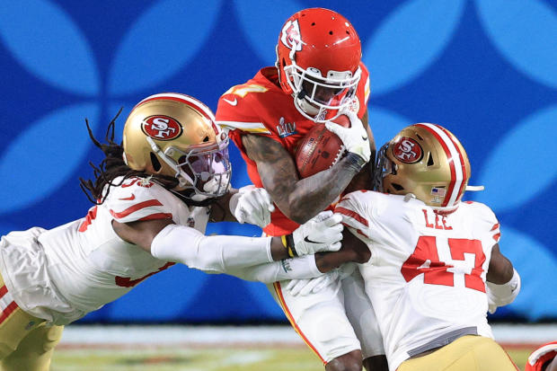 Super Bowl 2020: Mecole Hardman #17 of the Kansas City Chiefs is tackled by Marcell Harris #36 and Elijah Lee #47 of the San Francisco 49ers 