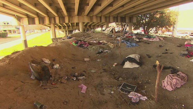 North Dallas Residents Concerned With Homeless Encampment Sitting On City Sand Pile 