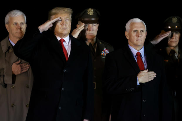 U.S. President Donald Trump salutes the transfer cases holding the remains of U.S. Army sergeant Gutierrez during a dignified transfer at Dover Air Force Base, in Dover, Delaware 