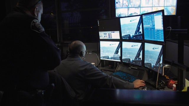 surveillance-police-look-at-screens.jpg 
