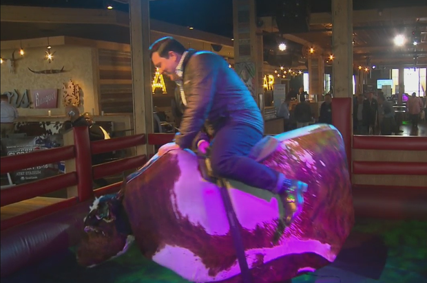 Ken Molestina rides mechanical bull 