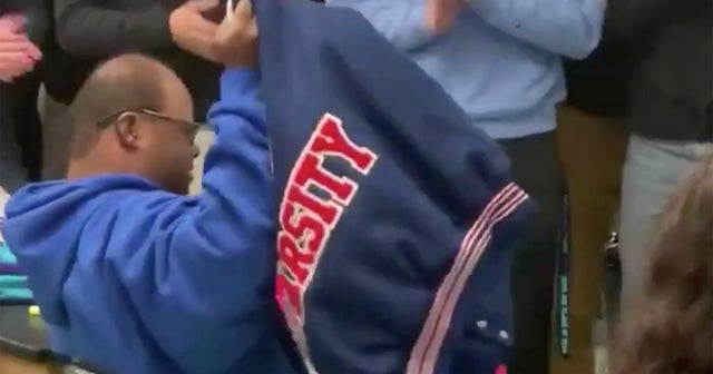 High school football team buys varsity jacket for special-needs student ...