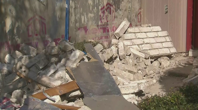 Aftermath of vehicle hitting garage 