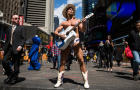The Naked Cowboy plays guitar in Times Square on April 9, 2014, in New York City. 