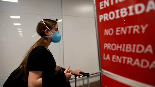 Traveller, wears a mask as a precautionary measure due to the coronavirus, is seen at Salgado Filho airport in Porto Alegre 