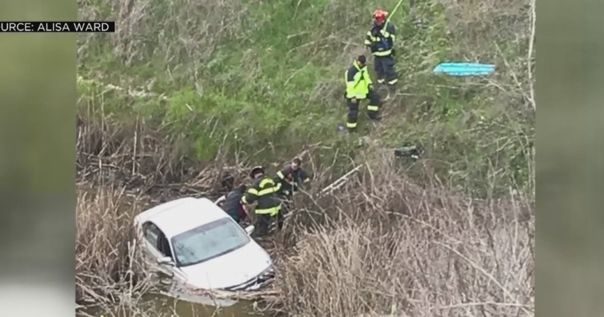 Family Discovers Woman Stranded Down Embankment Following Car Crash