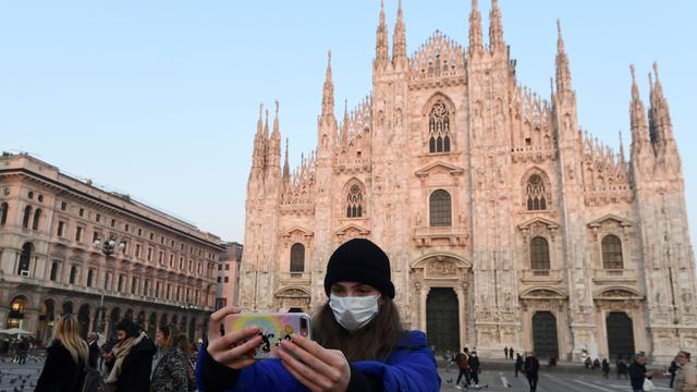 Military officers stand outside Duomo cathedral in Milan 