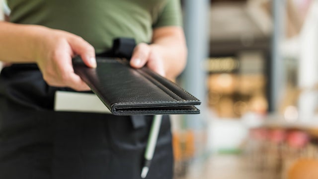 Waitress with restaurant bill 