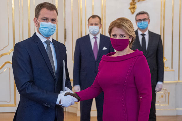 Slovakia's President Zuzana Caputova and Prime Minister Igor Matovic wearing protective face masks attend the cabinet's inauguration at Presidential Palace in Bratislava 