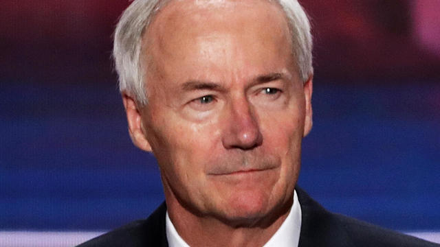 Arkansas Governor Asa Hutchinson stands on stage prior to the start of the second day of the Republican National Convention on July 19, 2016, at the Quicken Loans Arena in Cleveland, Ohio. 