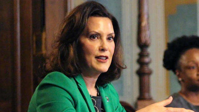 Michigan Governor Gretchen Whitmer addresses the state during a speech in Lansing, Michigan, April 9, 2020, in a pool photo provided by the governor's office. 