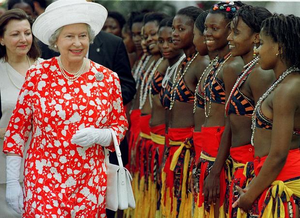 Britain's Queen Elizabeth II (L) smiles 
