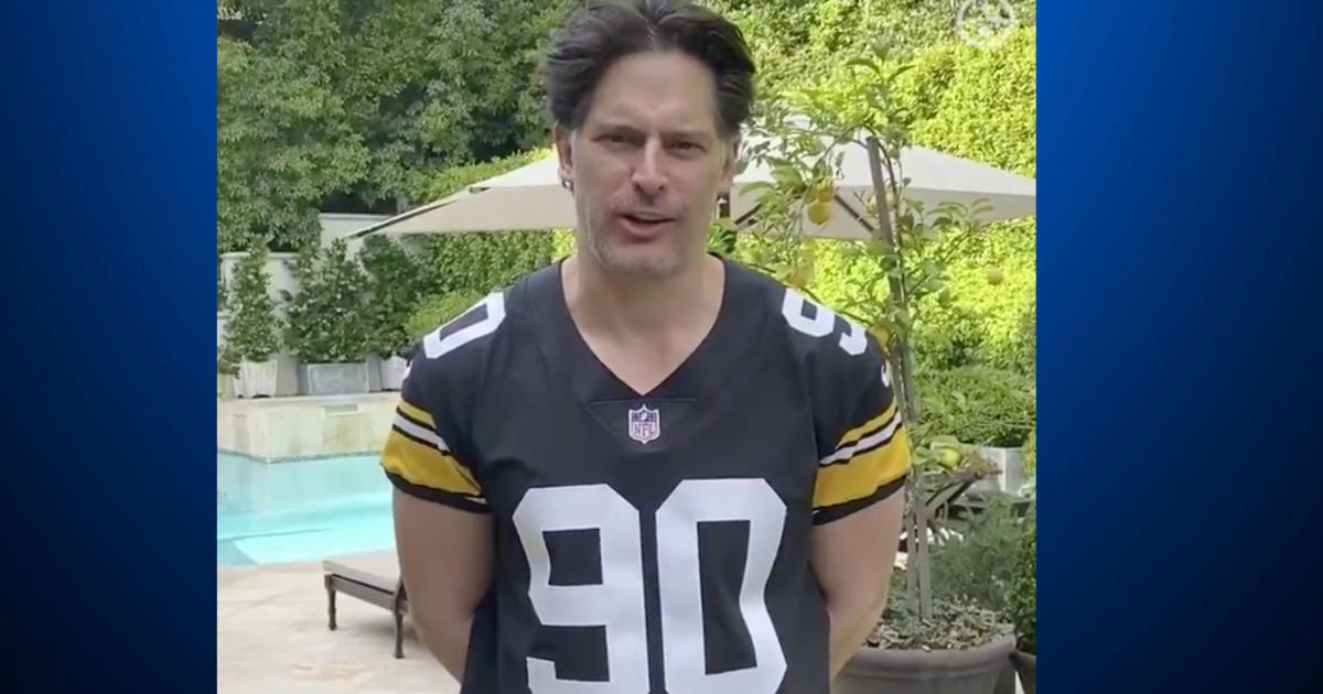 Joe Manganiello holds a Pittsburgh Steelers' Terrible Towel at