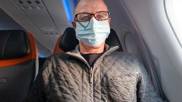 Senior man with protective mask against flu 
