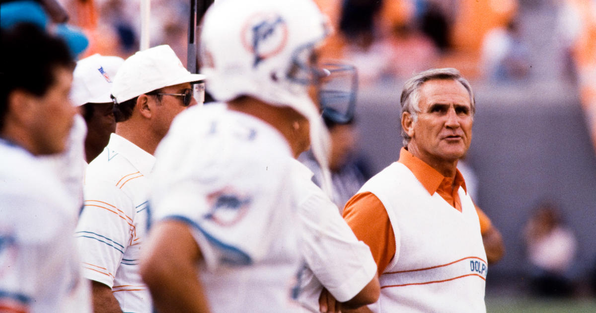 Coach of the Miami Dolphins' perfect season, Don Shula, with quarterback  Bob Griese during a halftime ceremony celebrating the undefeated 1972 team  as the Dolphins play host to the Cincinnati Bengals on