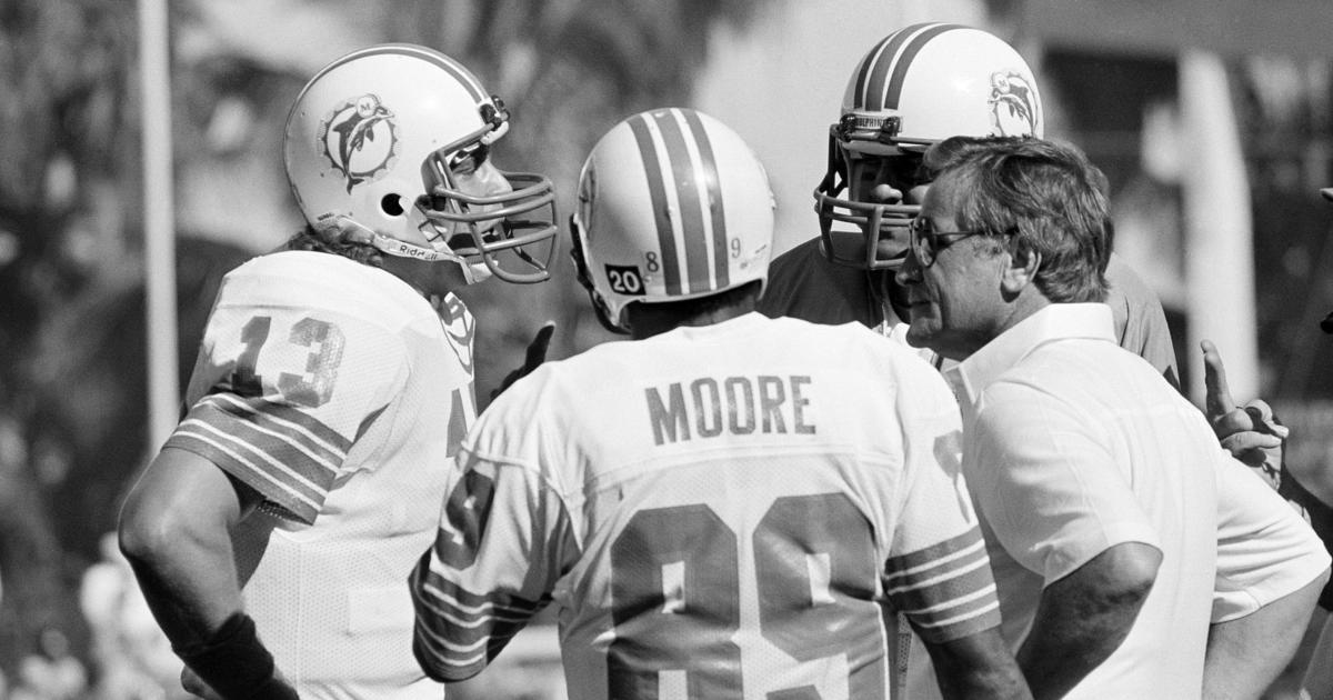 Coach of the Miami Dolphins' perfect season, Don Shula, with quarterback  Bob Griese during a halftime ceremony celebrating the undefeated 1972 team  as the Dolphins play host to the Cincinnati Bengals on