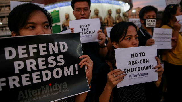 FILE PHOTO: Supporters of ABS-CBN, the country's top broadcast network, hold a rally against the Philippine government's move to scrap its franchises, in Quezon City, Metro Manila, 