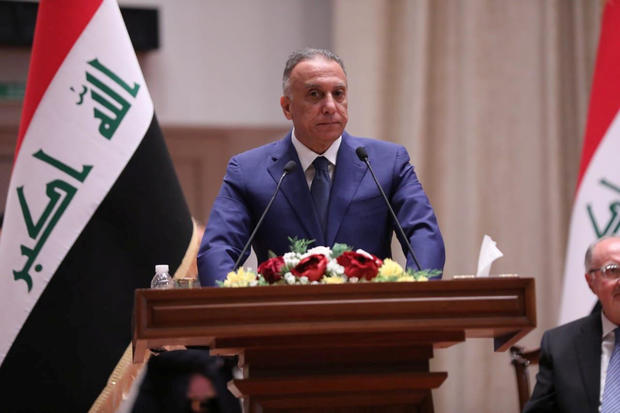 Iraqi Prime Minister-designate Mustafa al-Kadhimi delivers a speech during the vote on the new government at the parliament headquarters in Baghdad 