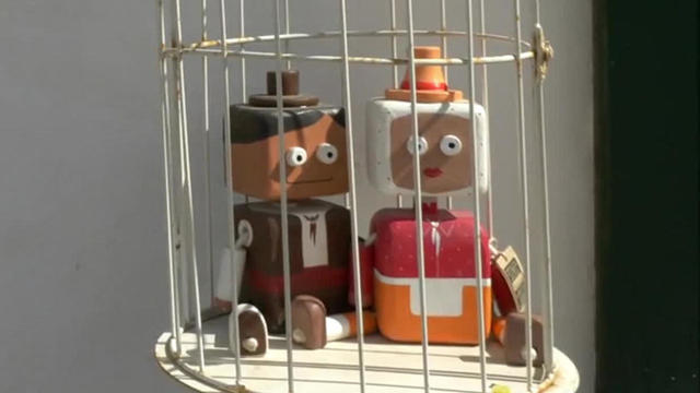 toy-couple-in-bird-cage-promo.jpg 