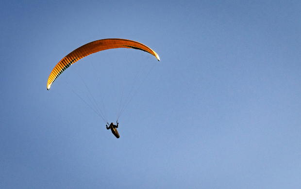 Paragliders soar in the sky 