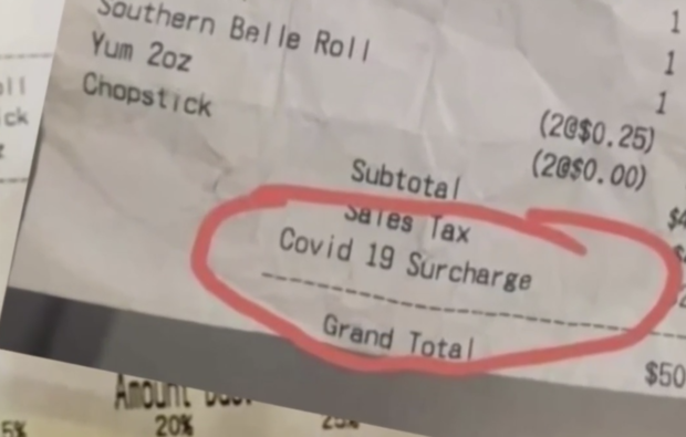 Receipt showing COVID-19 surcharge 