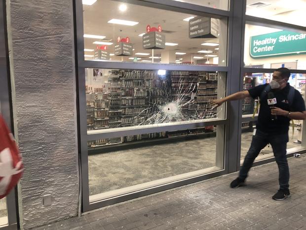 Damage to the front window of a CVS store in downtown Miami. 