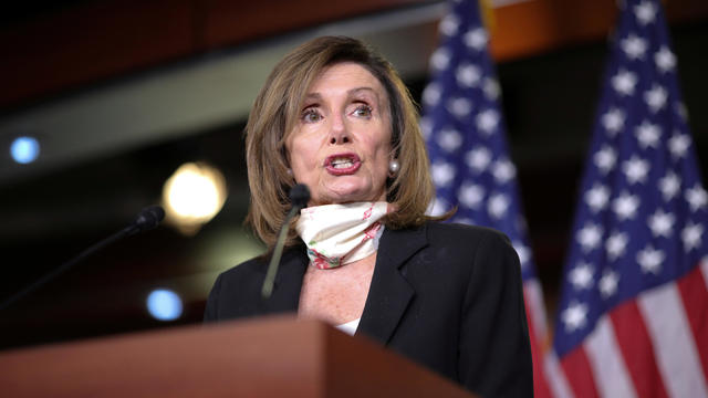 FILE PHOTO: Speaker of the House Pelosi delivers remarks during a weekly news conference on Capitol Hill in Washington 