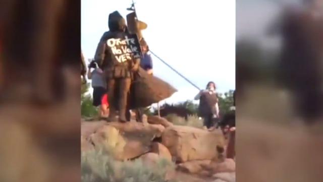 cbsn-fusion-man-shot-as-protesters-clash-with-civilian-militia-over-spanish-conquistador-statue-in-new-mexico.jpg 