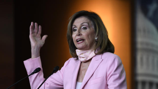 FILE PHOTO: Speaker of the House Pelosi delivers remarks during a weekly news conference on Capitol Hill in Washington 