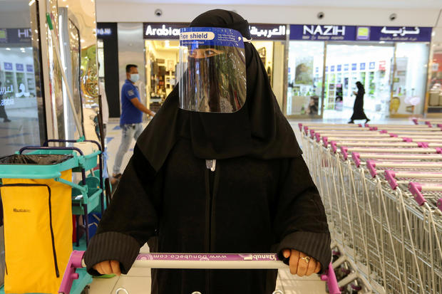 A Saudi woman, wearing a face shield, shops at a supermarket, following the outbreak of the coronavirus disease (COVID-19) in Riyadh 