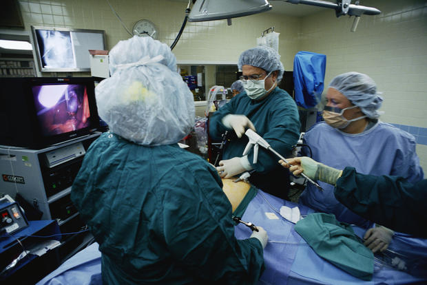 Surgeon and Staff Performing Surgery 