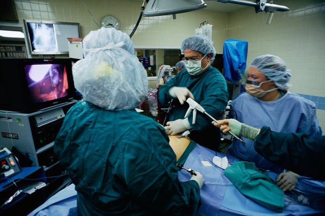 Surgeon and Staff Performing Surgery 