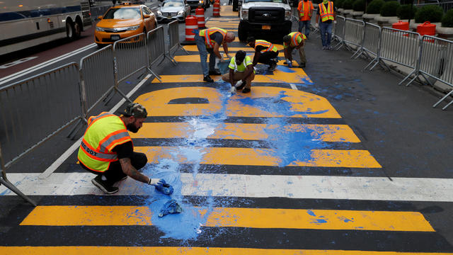 Protesters throw paint on a Black Lives Matter mural outside of Trump Tower on Fifth Avenue in Manhattan, New York 