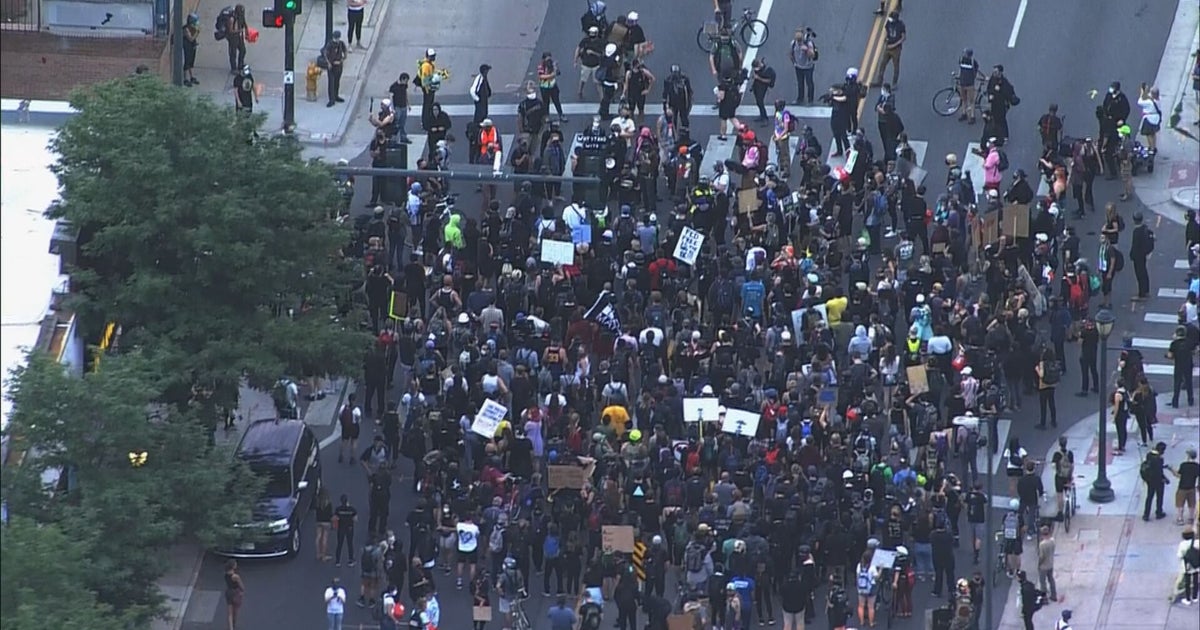 Dozens Of Protesters March Through Downtown Denver - CBS Colorado
