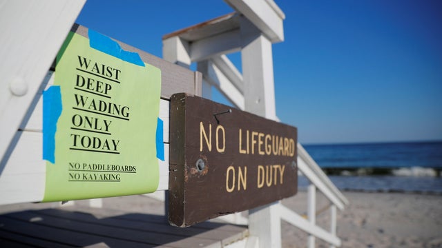 A sign announces that swimming is restricted to waist deep wading in Cape Elizabeth 