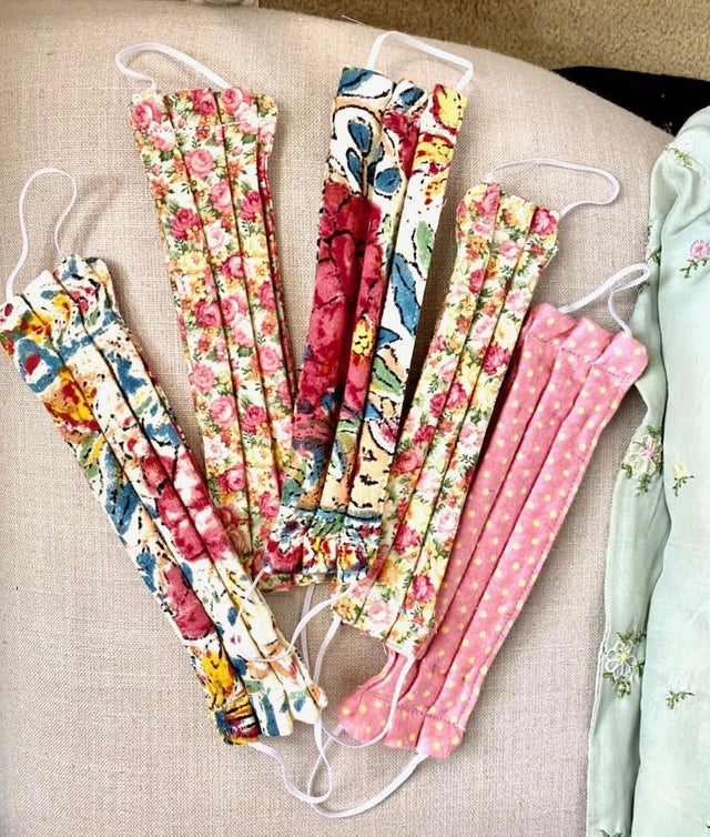 Couple restores 100-year-old sewing machine to make face masks 