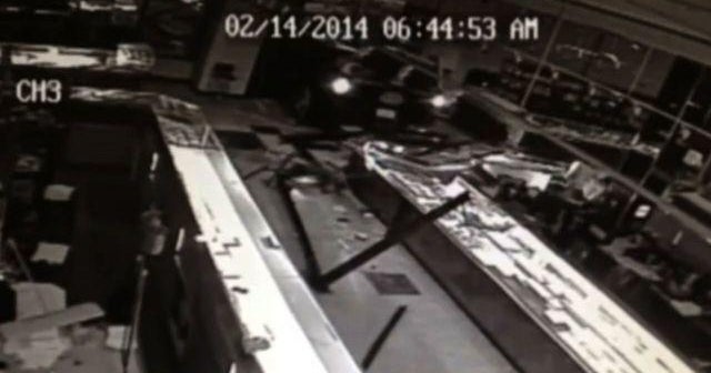 Surveillance video shows thieves smashing into store - CBS News
