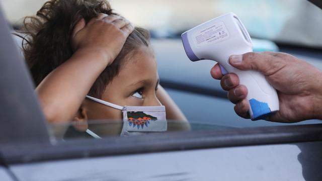 California School Kids Attend School Remotely Within Small Learning Groups At Enrichment Centers 