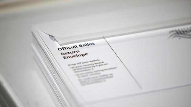 Poll workers prepare absentee ballots for the general election in Raleigh 