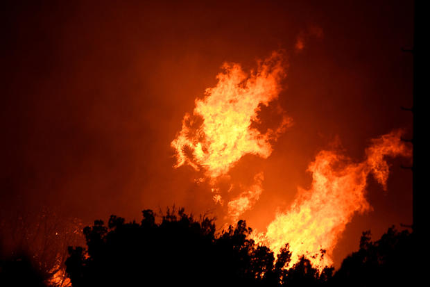 FILE PHOTO: Wildfire in California burns through the night north of Los Angeles 