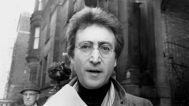 Lennon-outside-NYC-apt.jpg 
