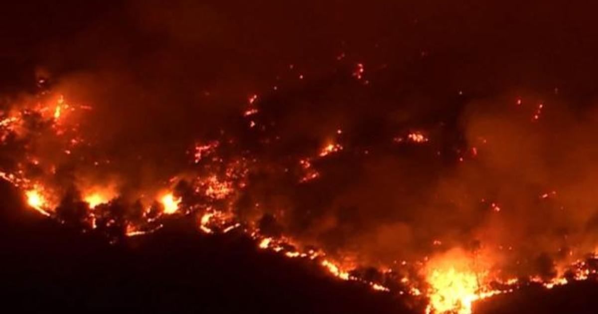 Fast moving flames in Northern California destroy dozens of homes and ...